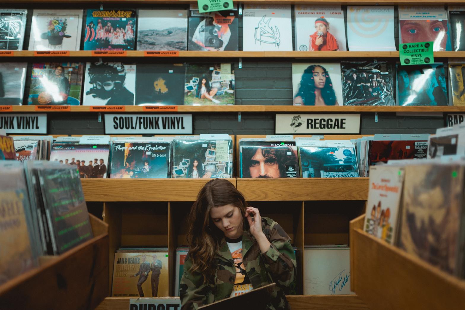 Woman in record store