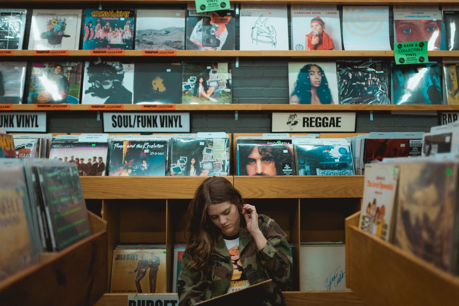 Woman in record store